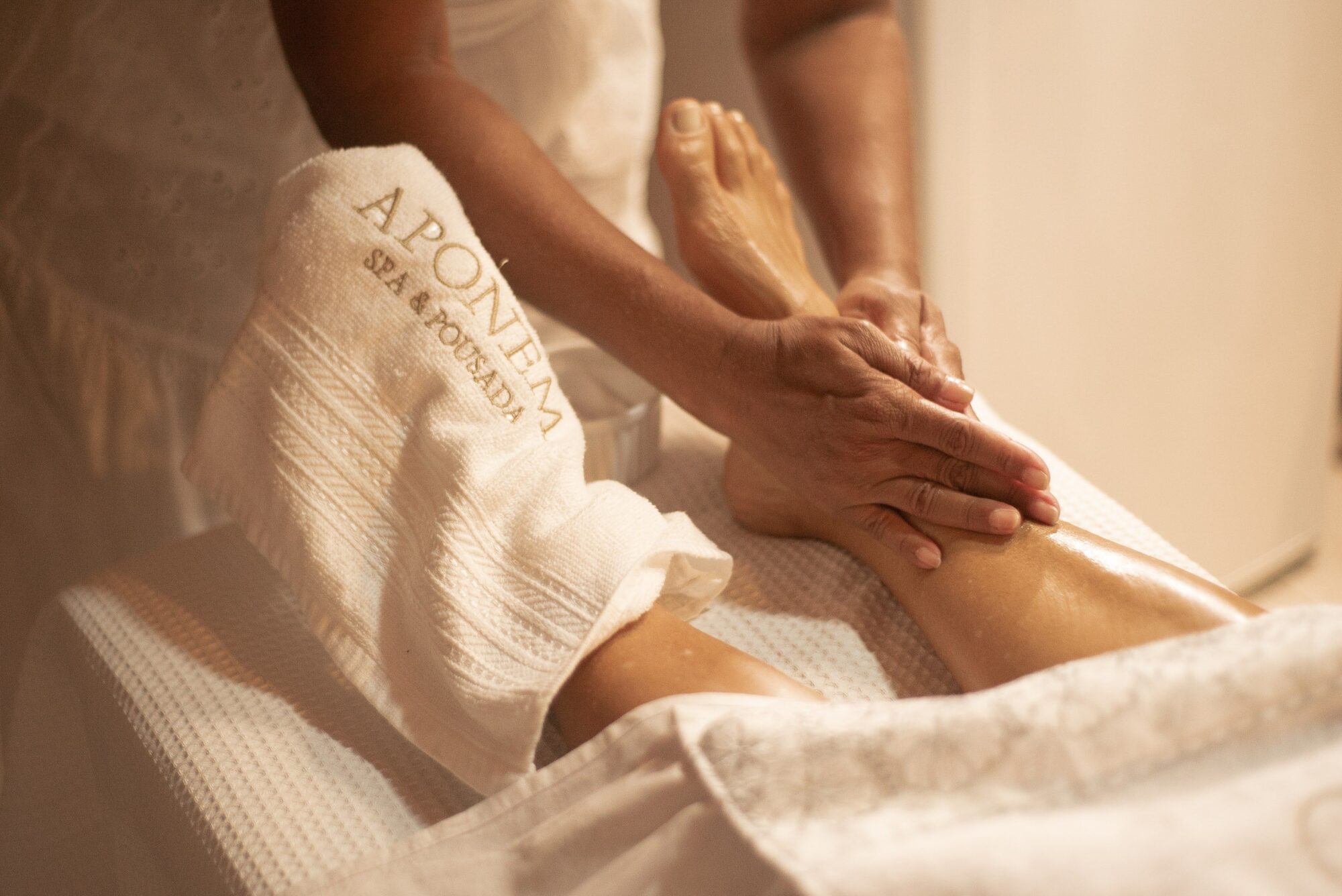 Close-up of a foot massage at Aponema Spa, emphasizing relaxation and wellness.