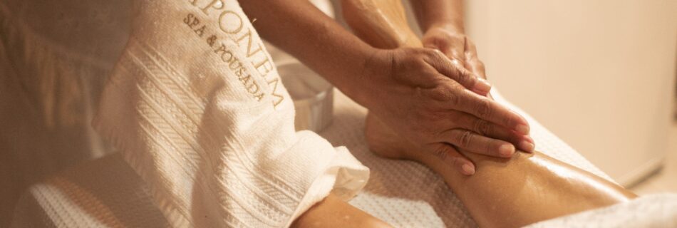 Close-up of a foot massage at Aponema Spa, emphasizing relaxation and wellness.